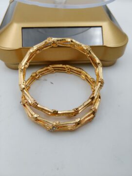 Gold-Plated Bamboo Style Cutwork Bangle Pair with AD Stones.